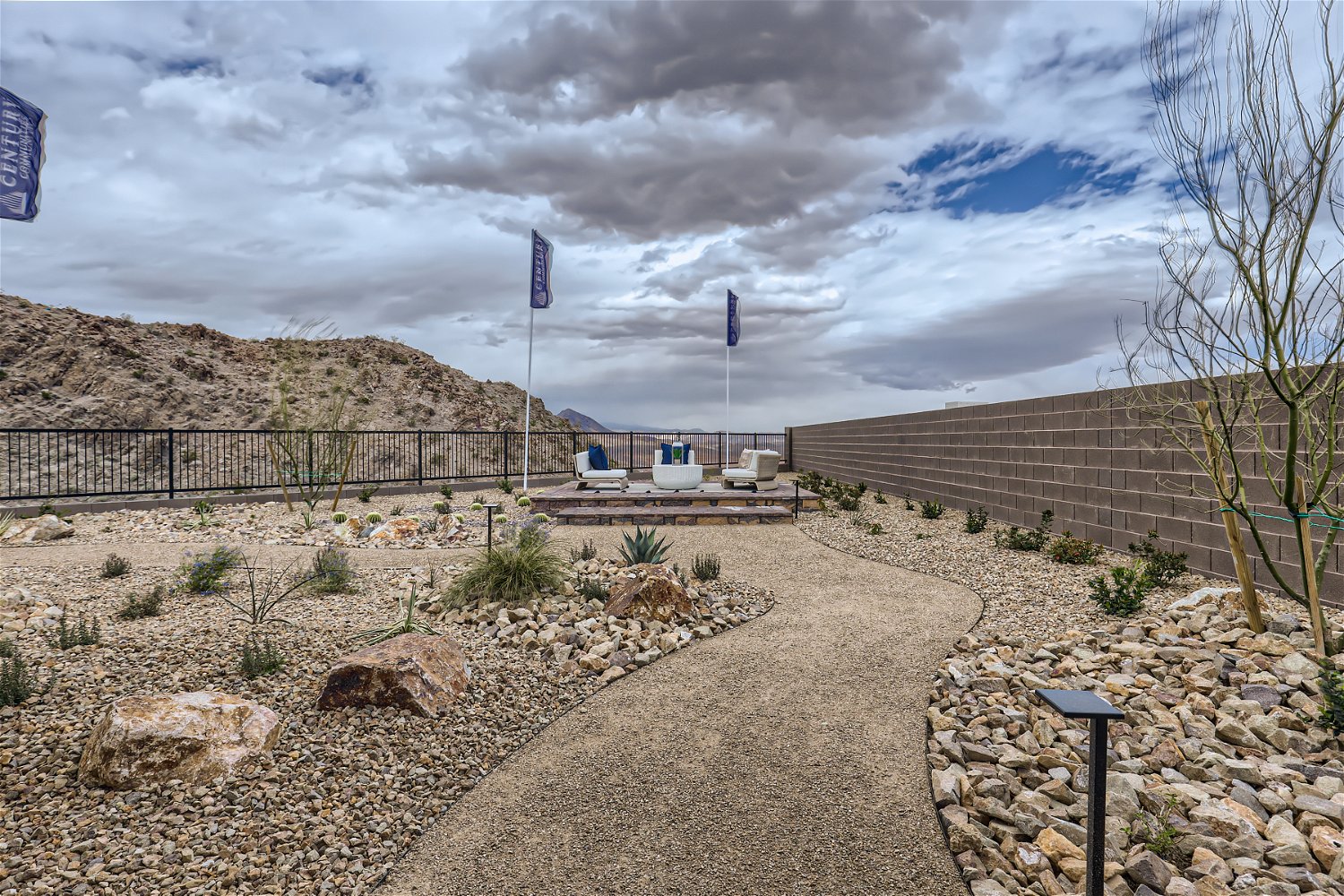 A dirt path with flags on it.