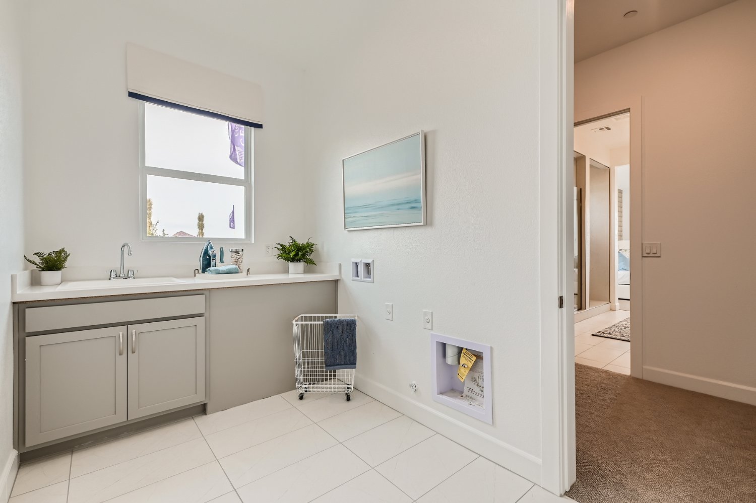 A bathroom with white tiles.