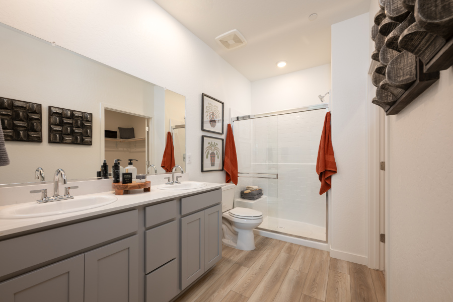 A bathroom with a shower and toilet.