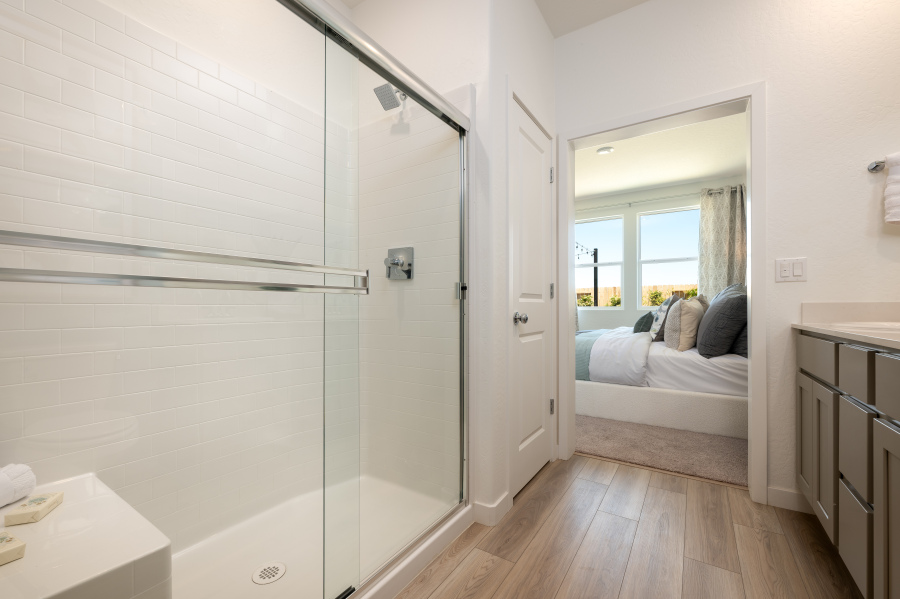 A bedroom with a glass door.