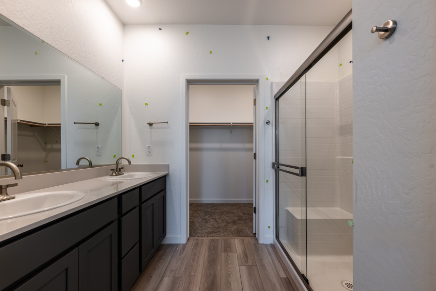 A bathroom with a glass shower.