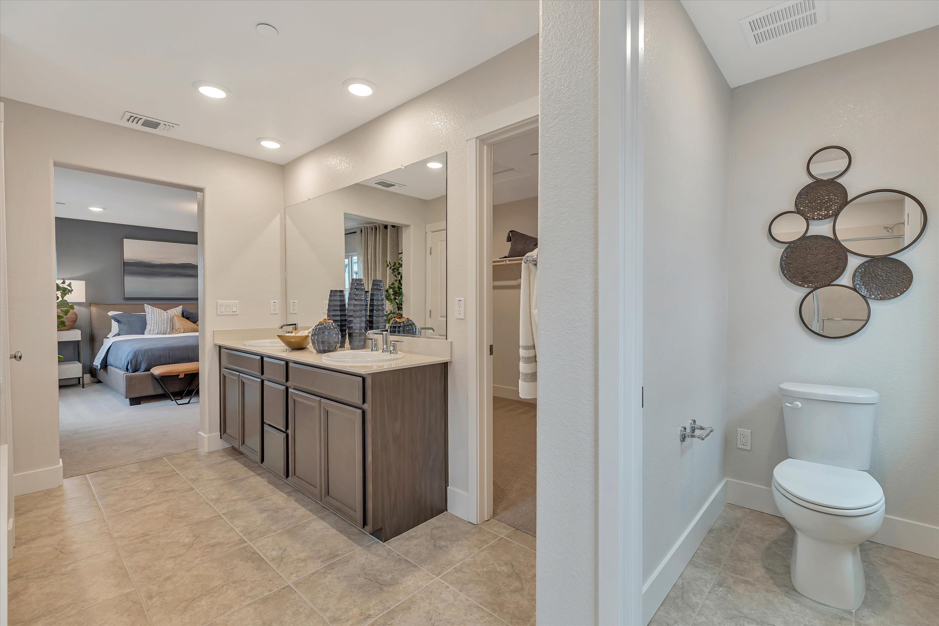 A bathroom with a toilet and sink.