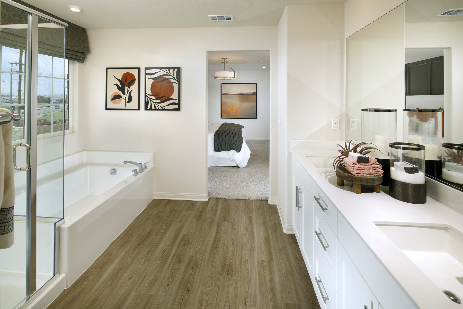 A bathroom with a tub sink and a toilet.