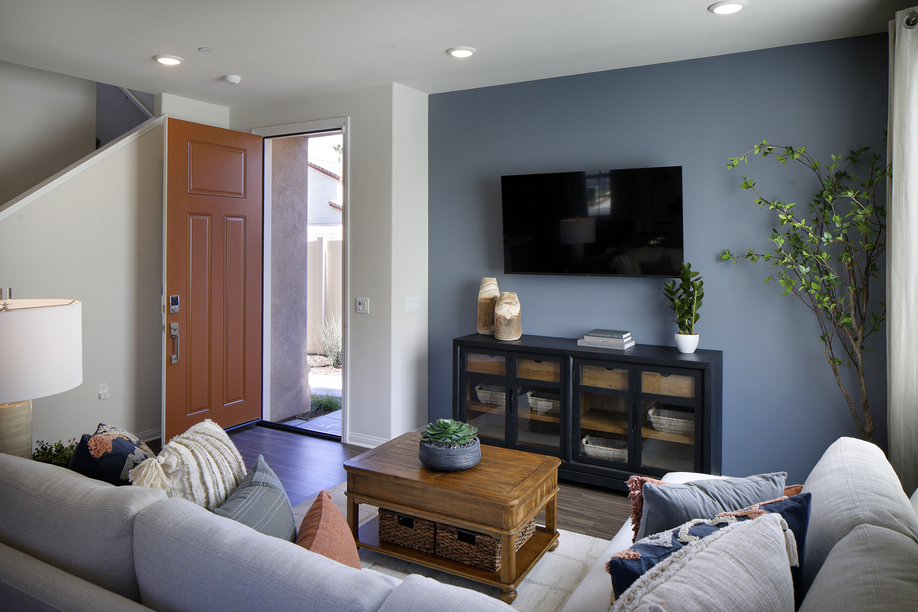 A living room with a tv and couches.