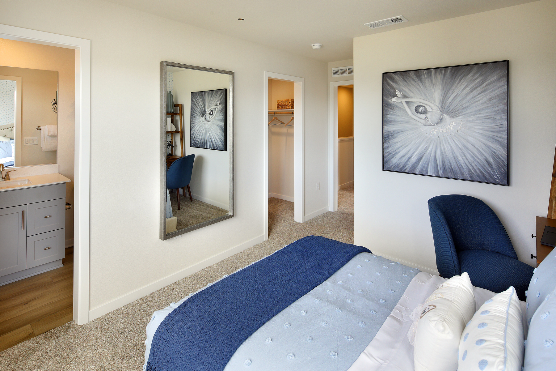 A bedroom with a blue bed.