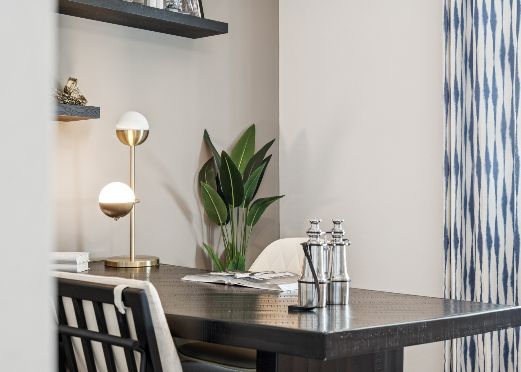 A table with a plant on it.