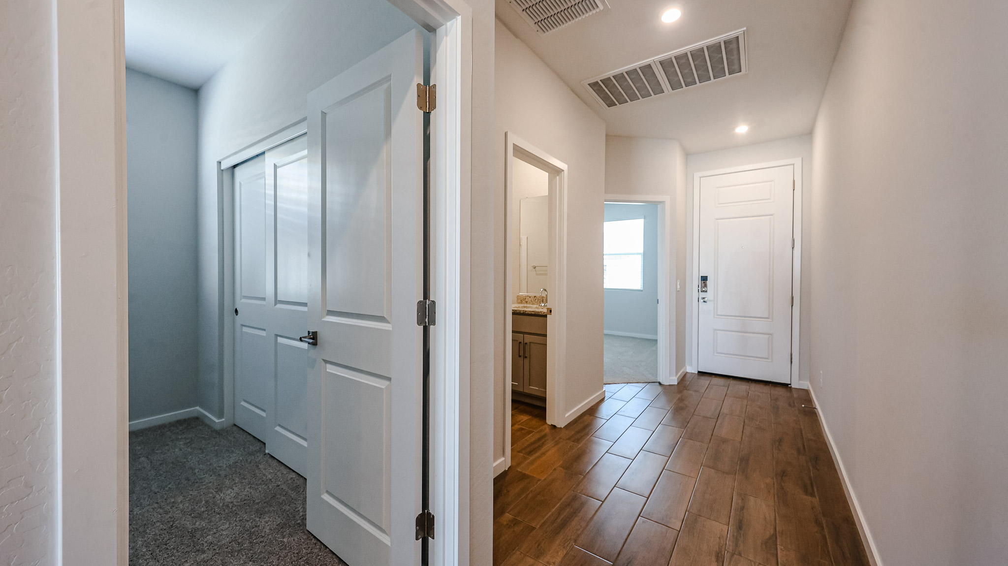 A hallway with white doors.