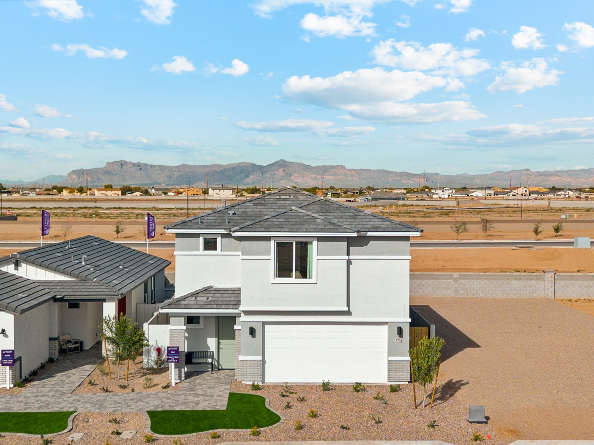 A group of buildings with a mountain in the background.