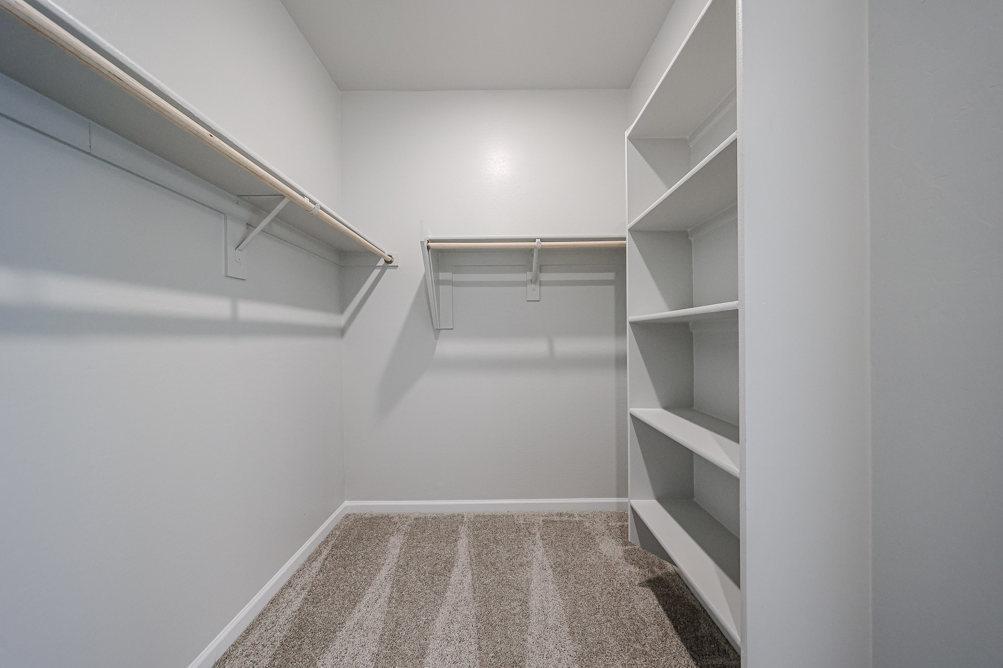 A white room with a staircase.