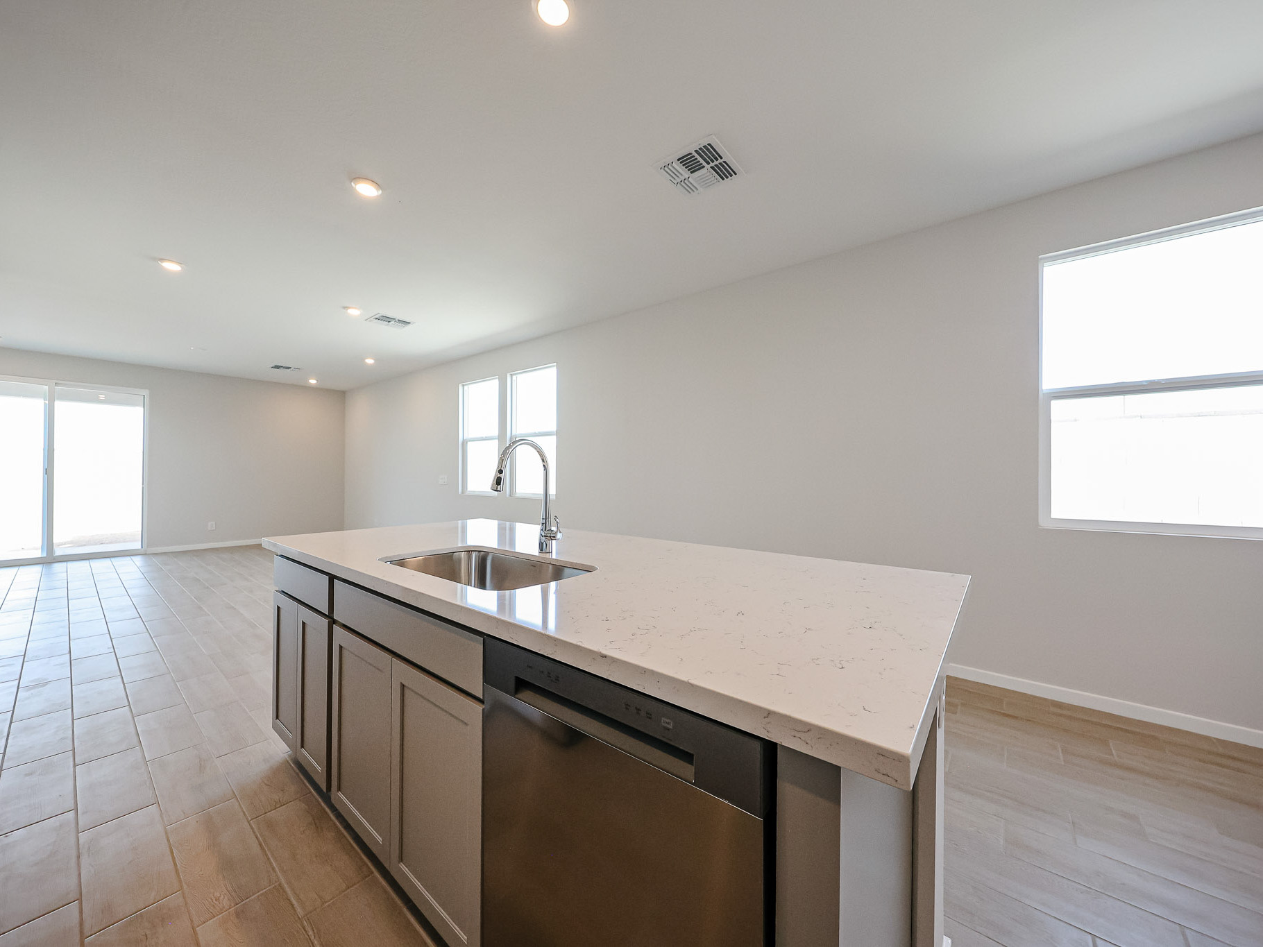 A kitchen with a marble countertop.