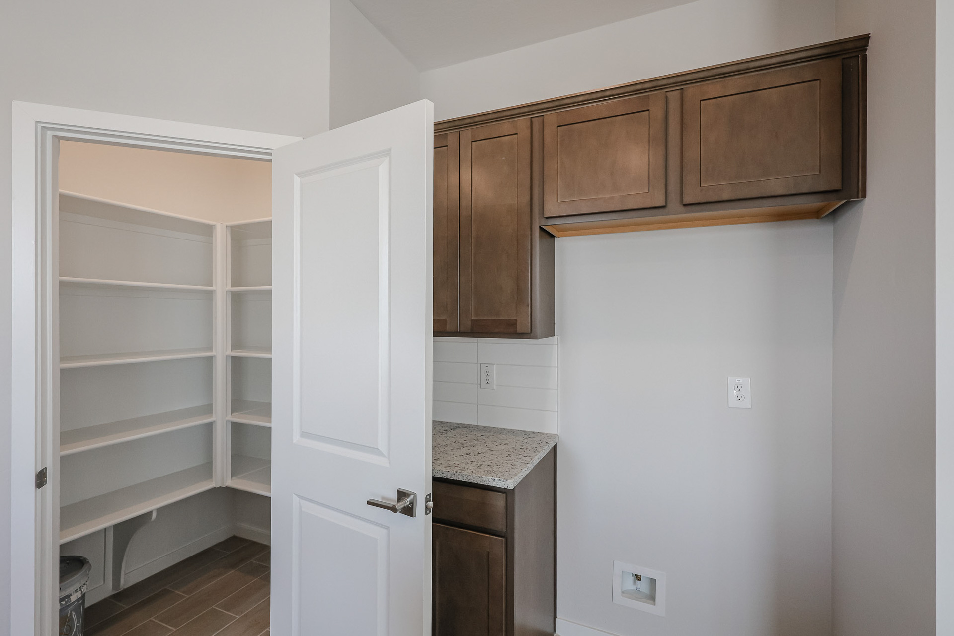 A kitchen with a white door.