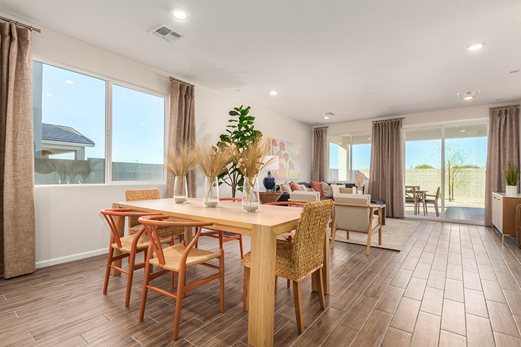 A room with a table and chairs.