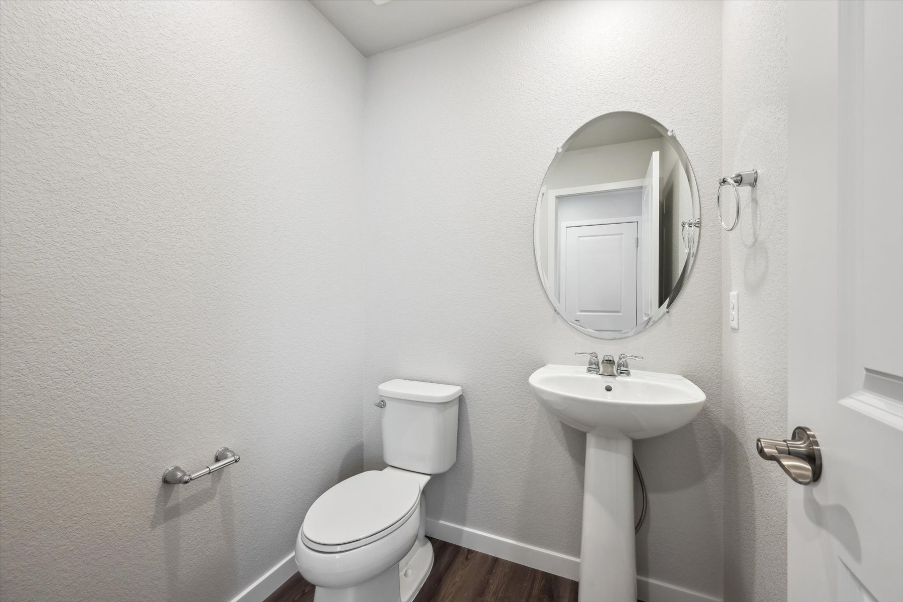 A bathroom with a sink and toilet.
