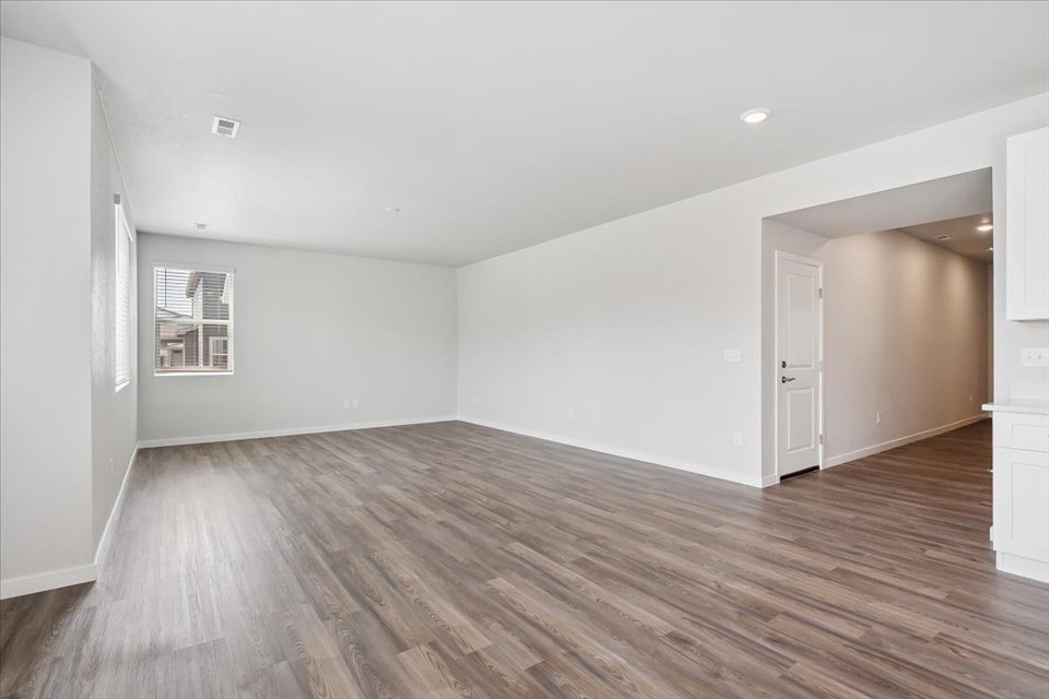 A room with a wood floor.