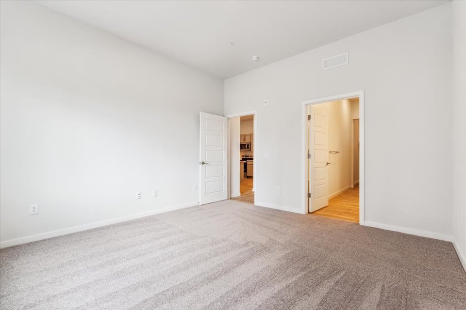 A hallway with white walls.