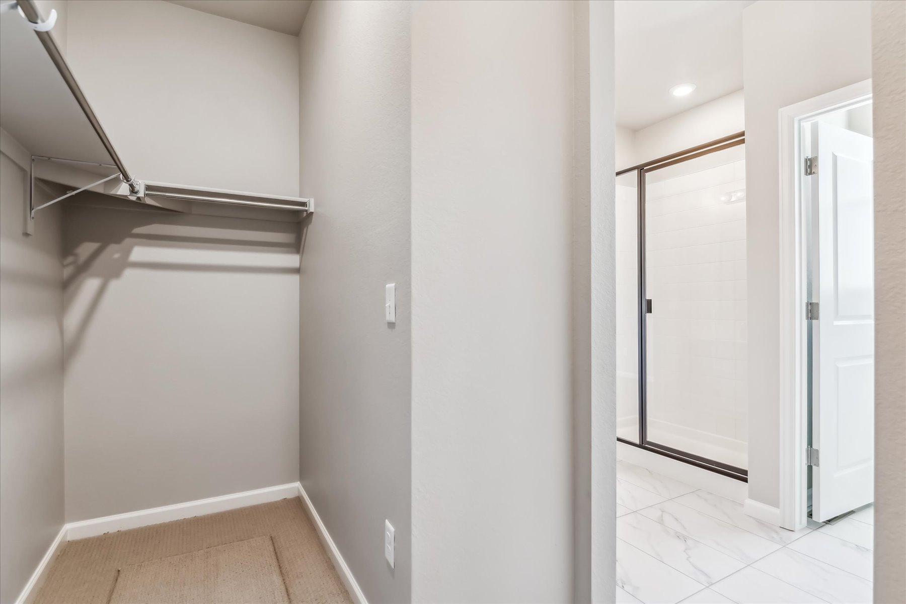 A hallway with white walls.