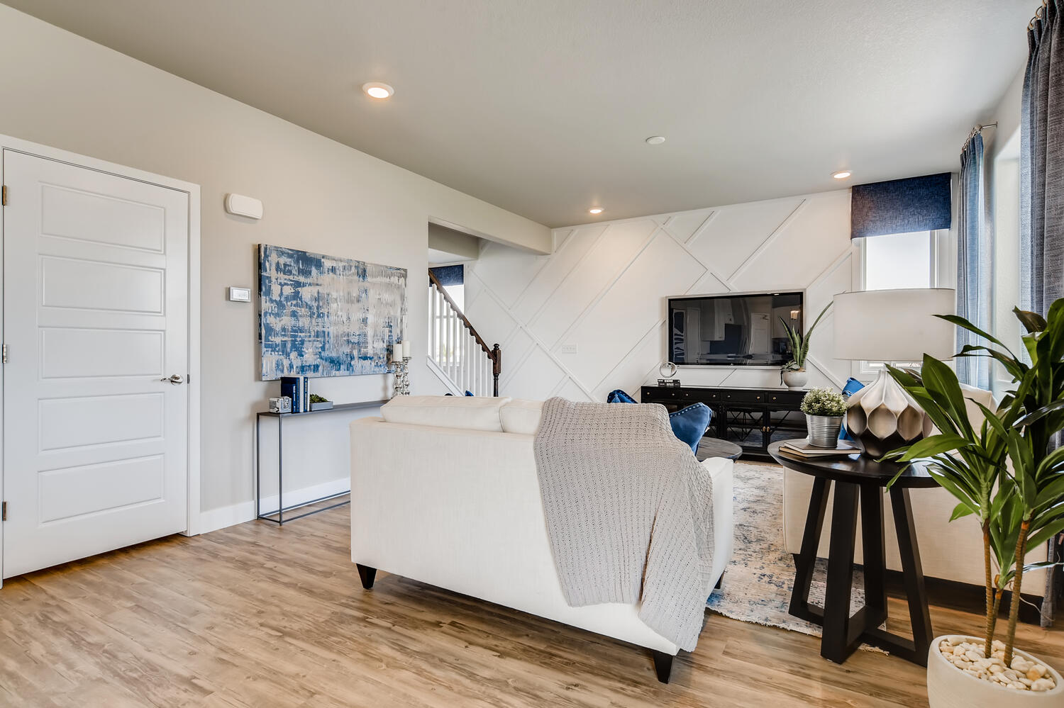 A living room with a white couch.