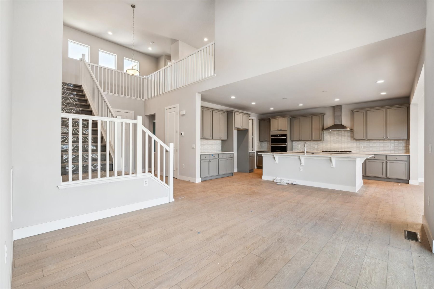 A large white house with a wood floor.