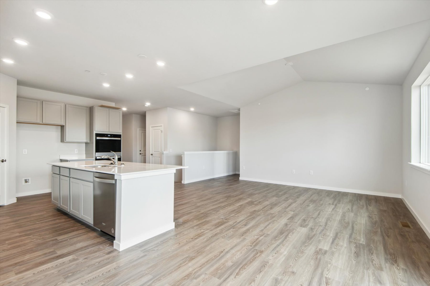 A large kitchen with white cabinets.