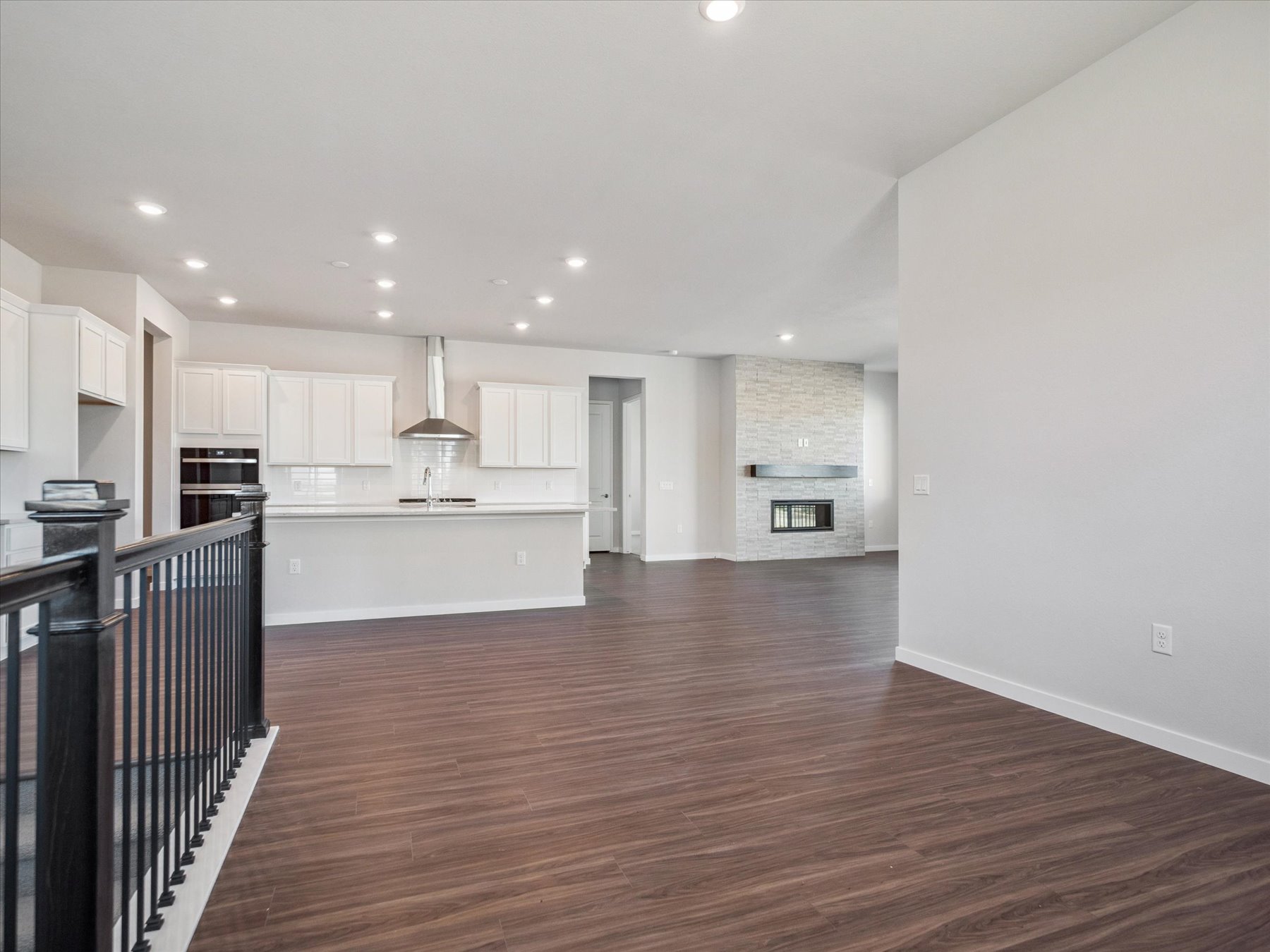 A large kitchen with white cabinets.