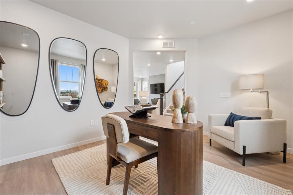 A room with a table and chairs.