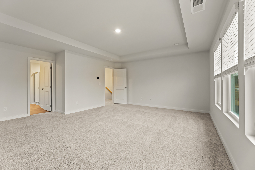 A room with white walls and windows.