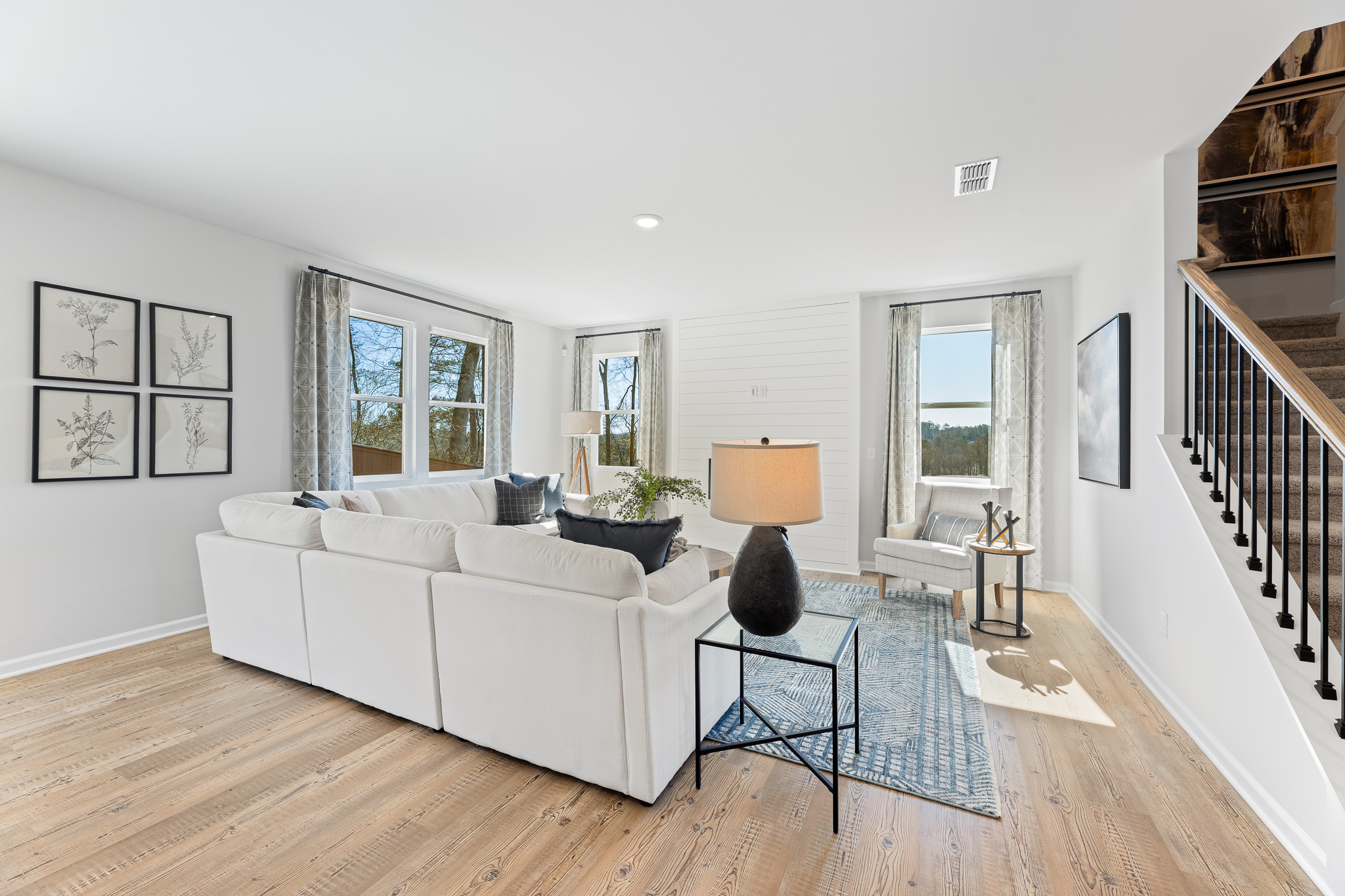 A living room with a white couch.