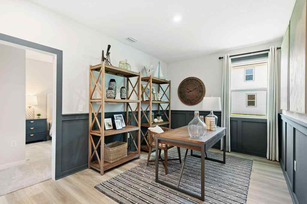 A room with a table and shelves.