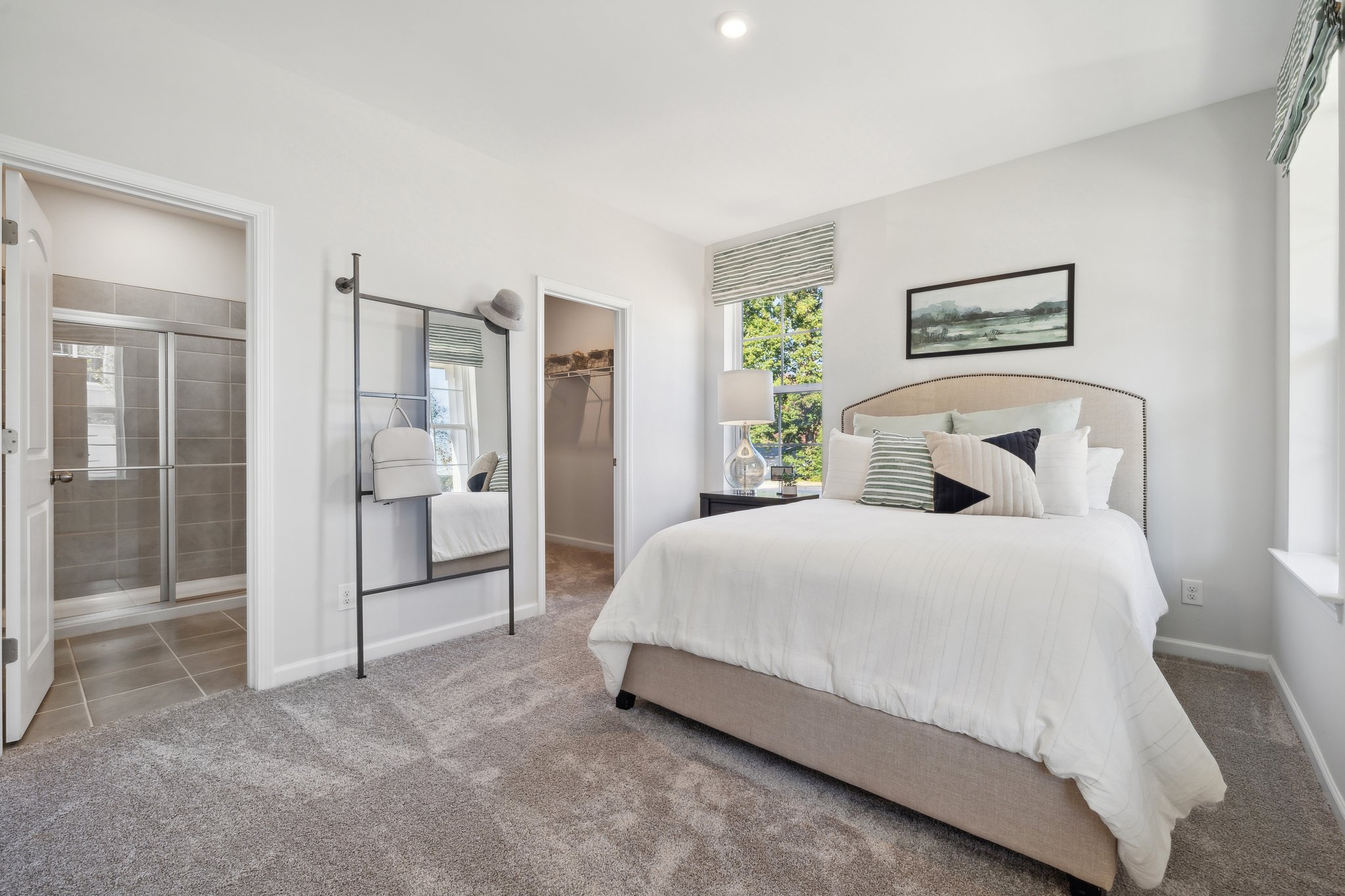 A bedroom with a large bed.