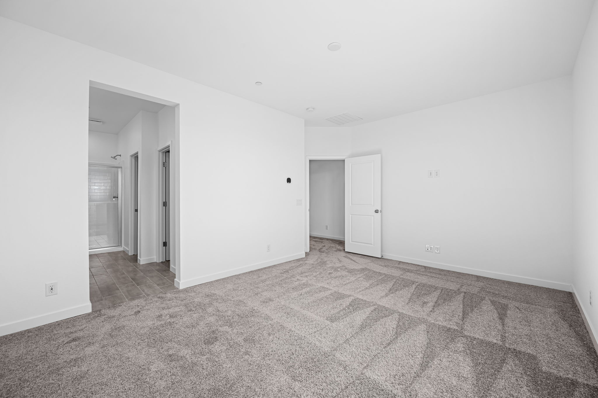 A hallway with white walls.