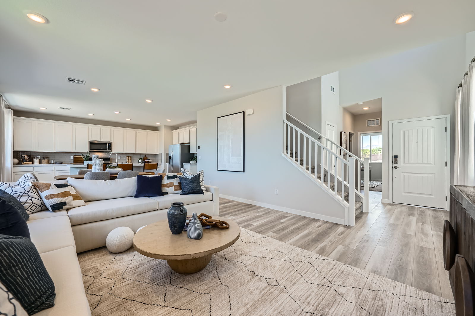 A living room with a wood floor.
