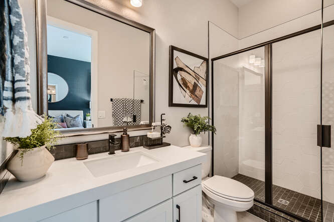 A bathroom with a glass shower.
