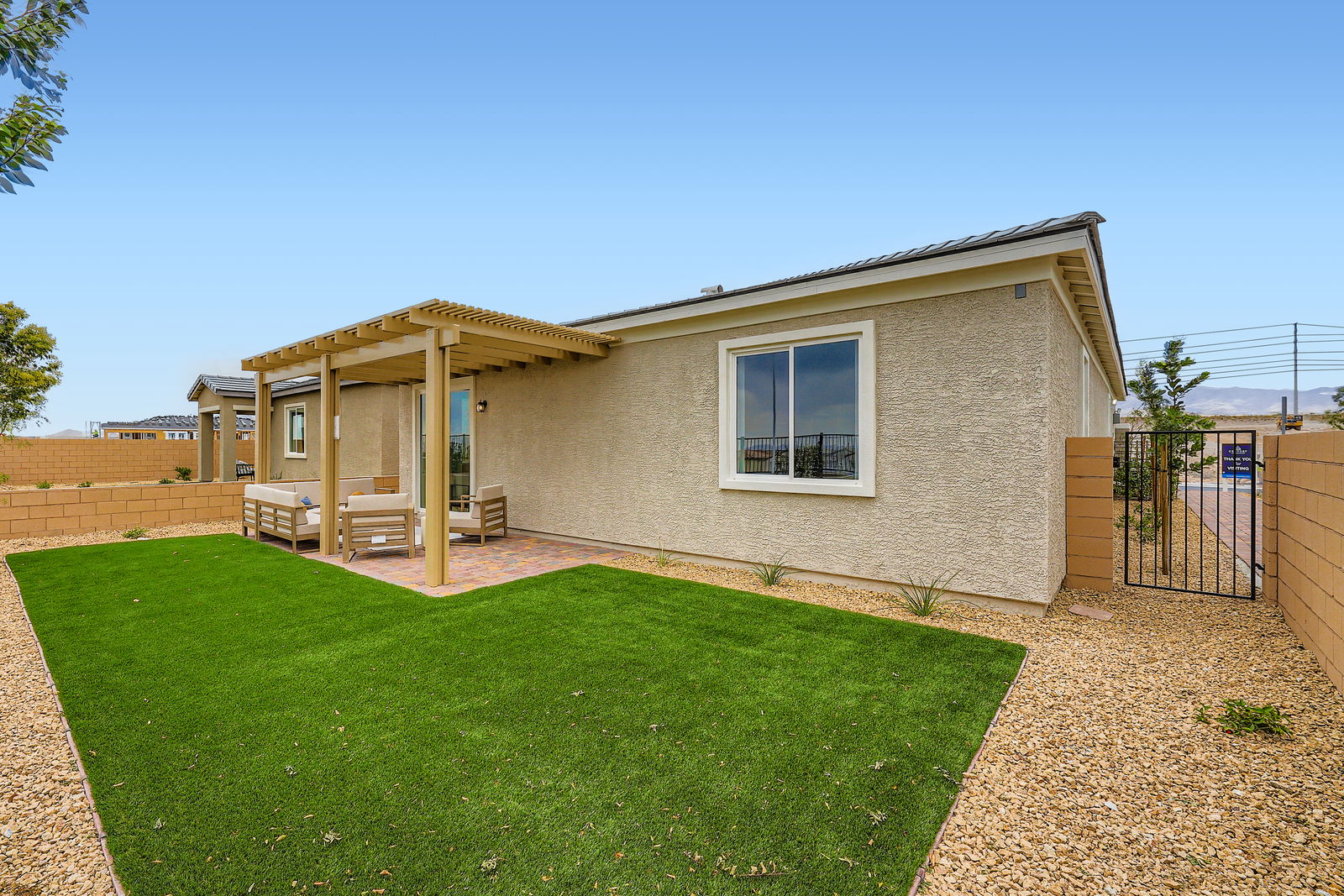 A house with a green lawn.