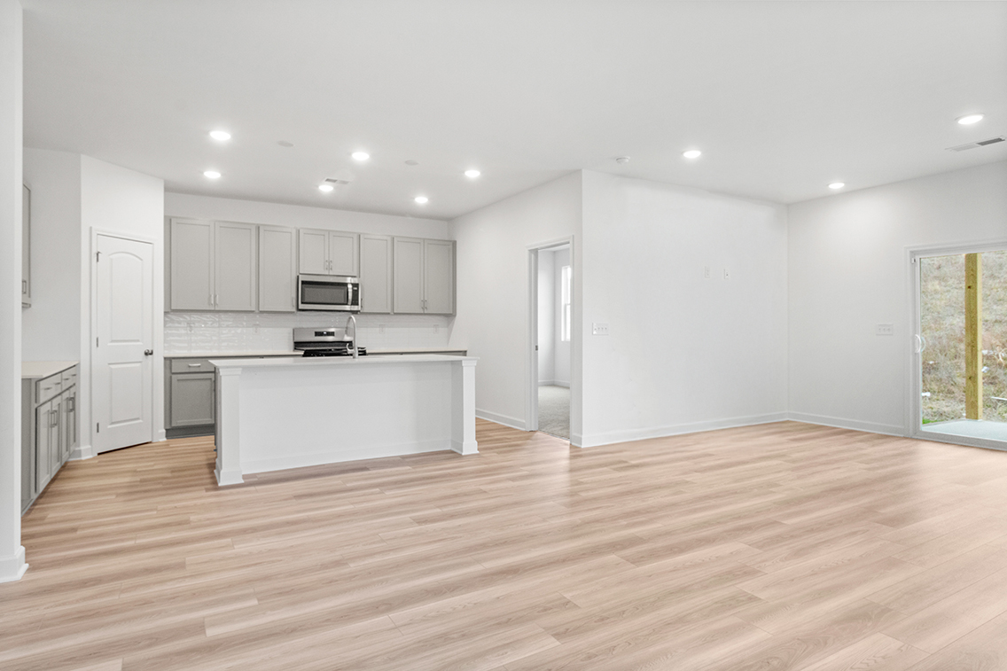 A large kitchen with white cabinets.