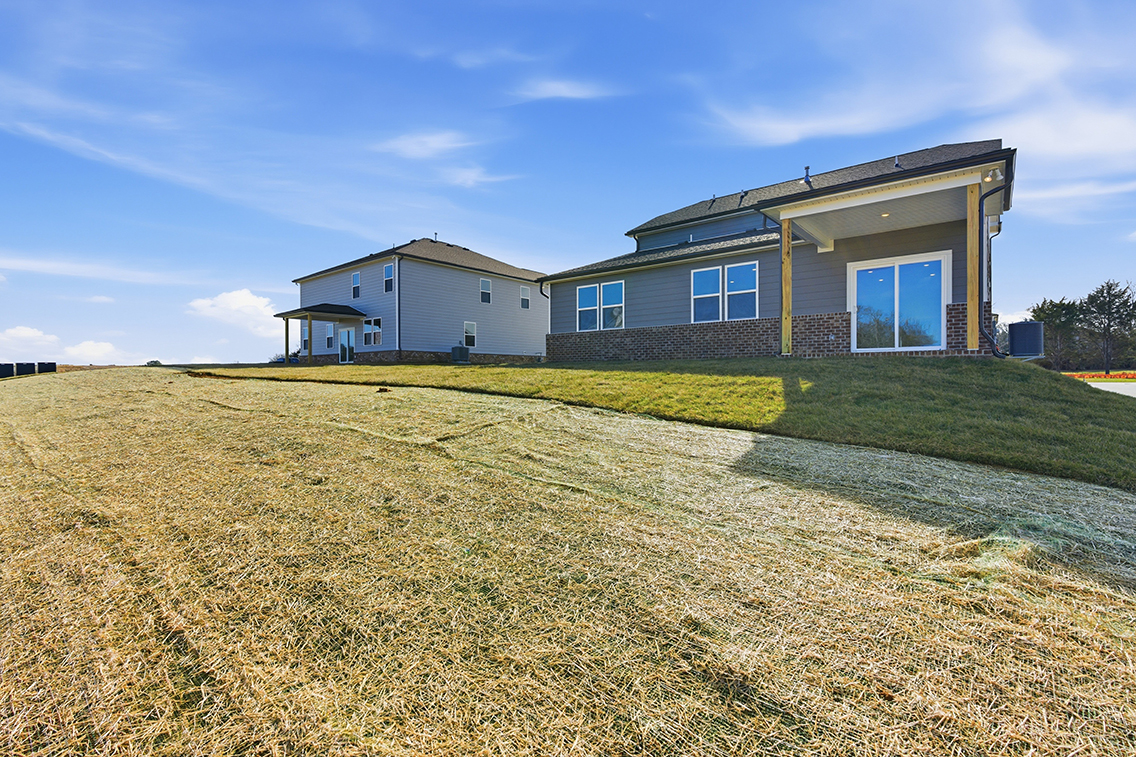 A house with a grass yard.