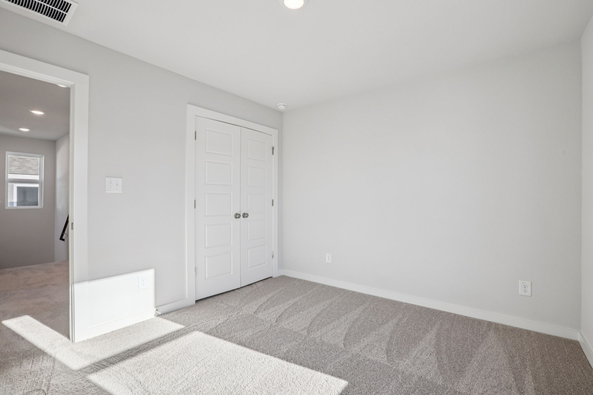 A room with white doors.