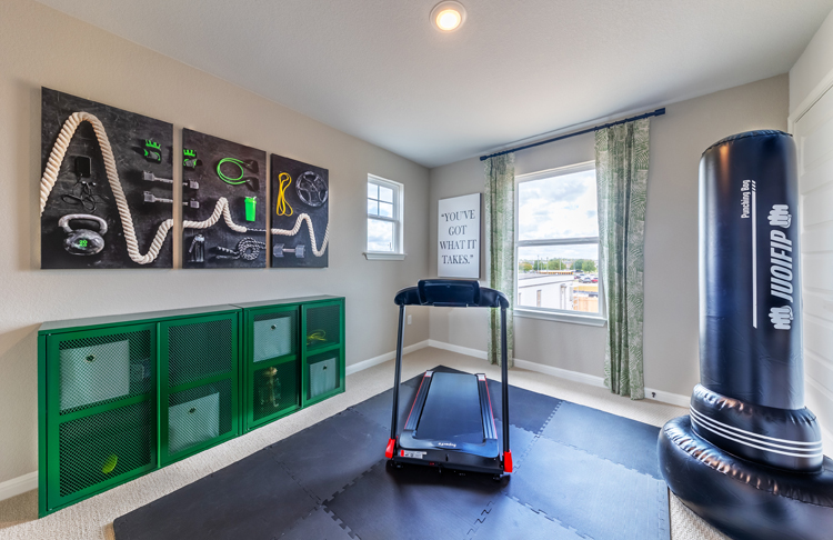 A room with a treadmill and a treadmill.