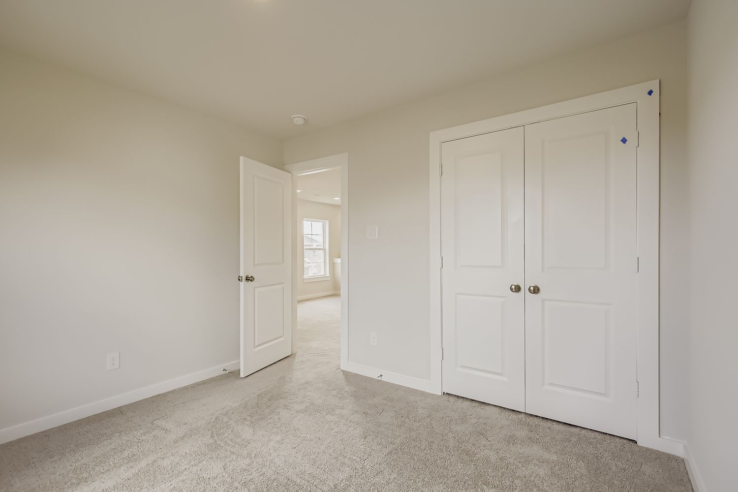 A room with white doors.