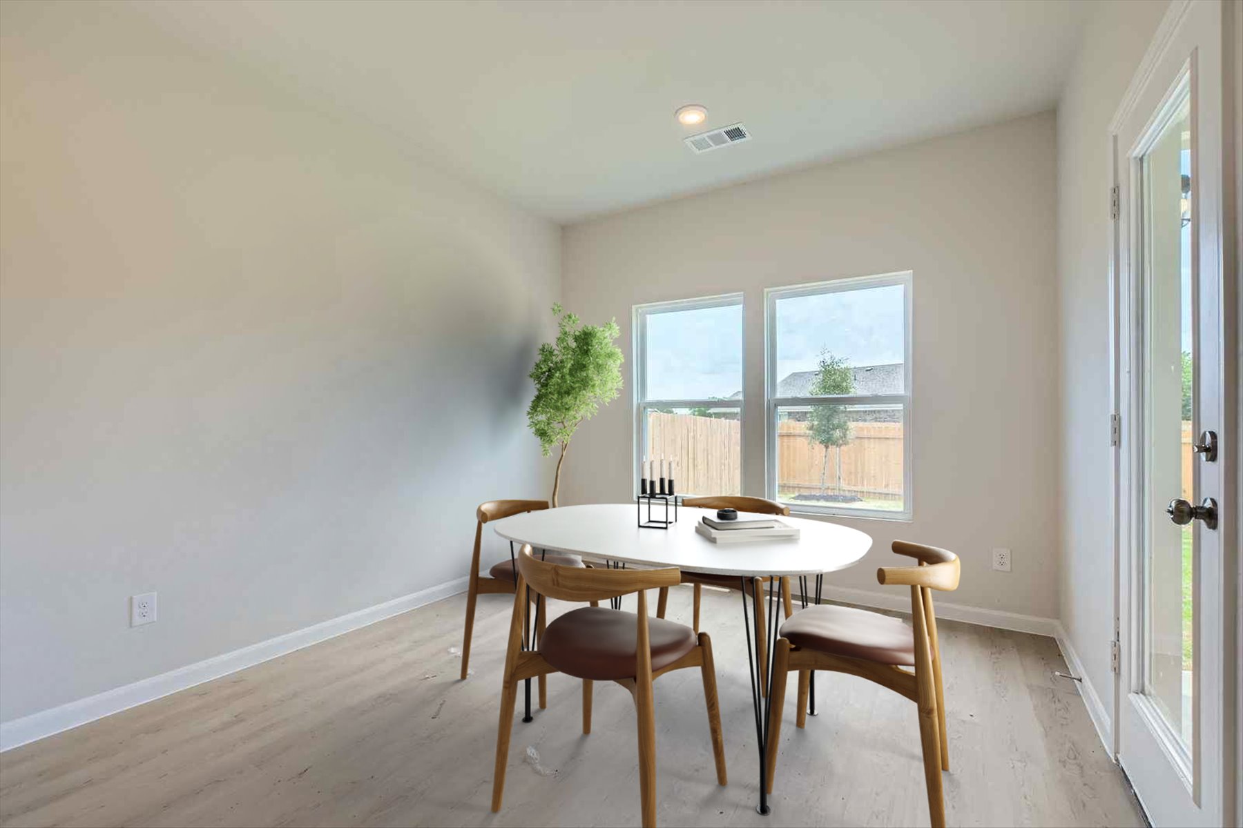 A dining room table with chairs.