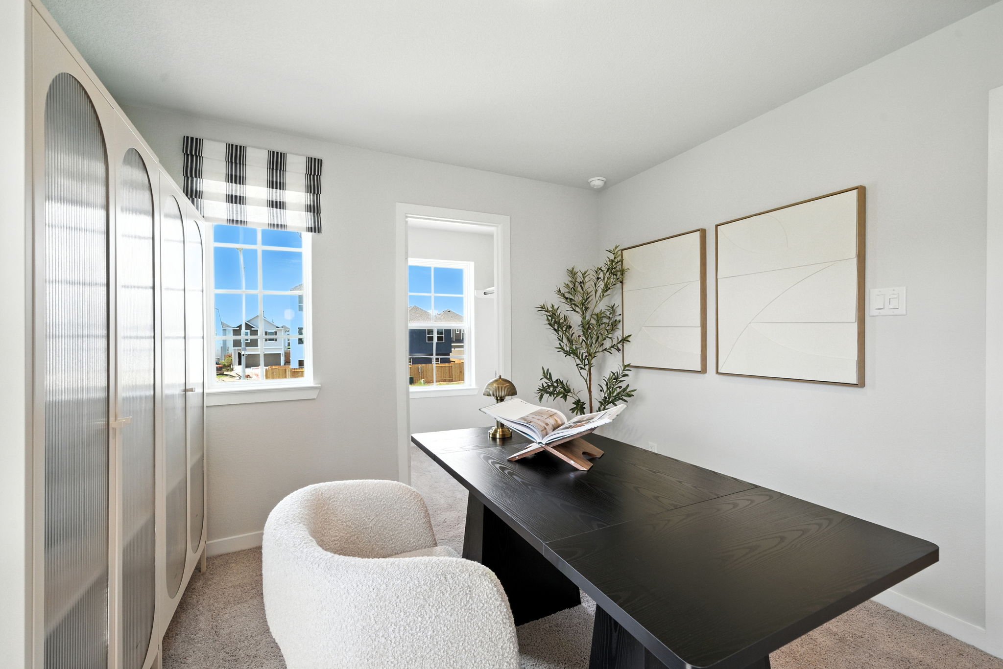 A room with a table and chairs.