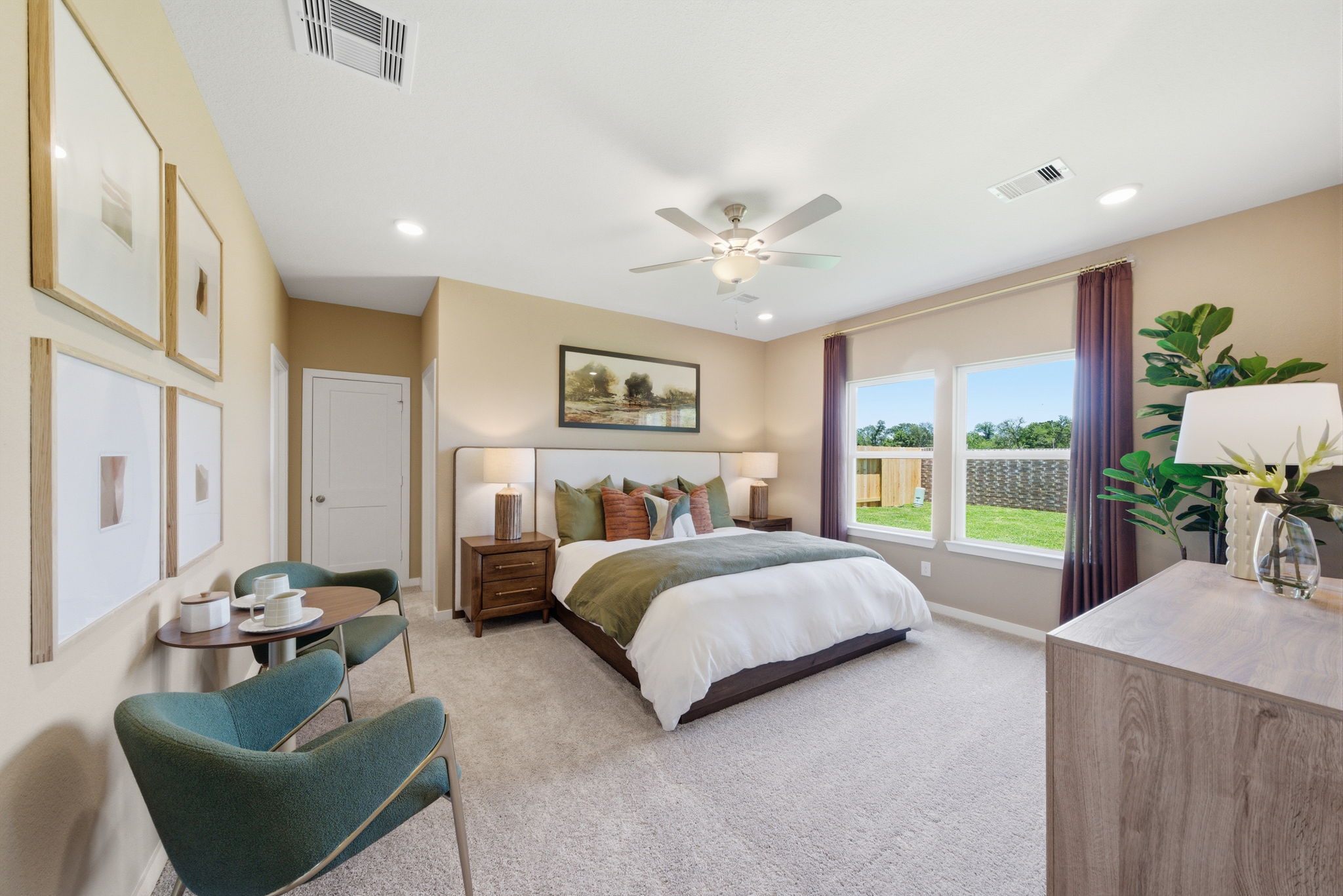 A bedroom with a large window.