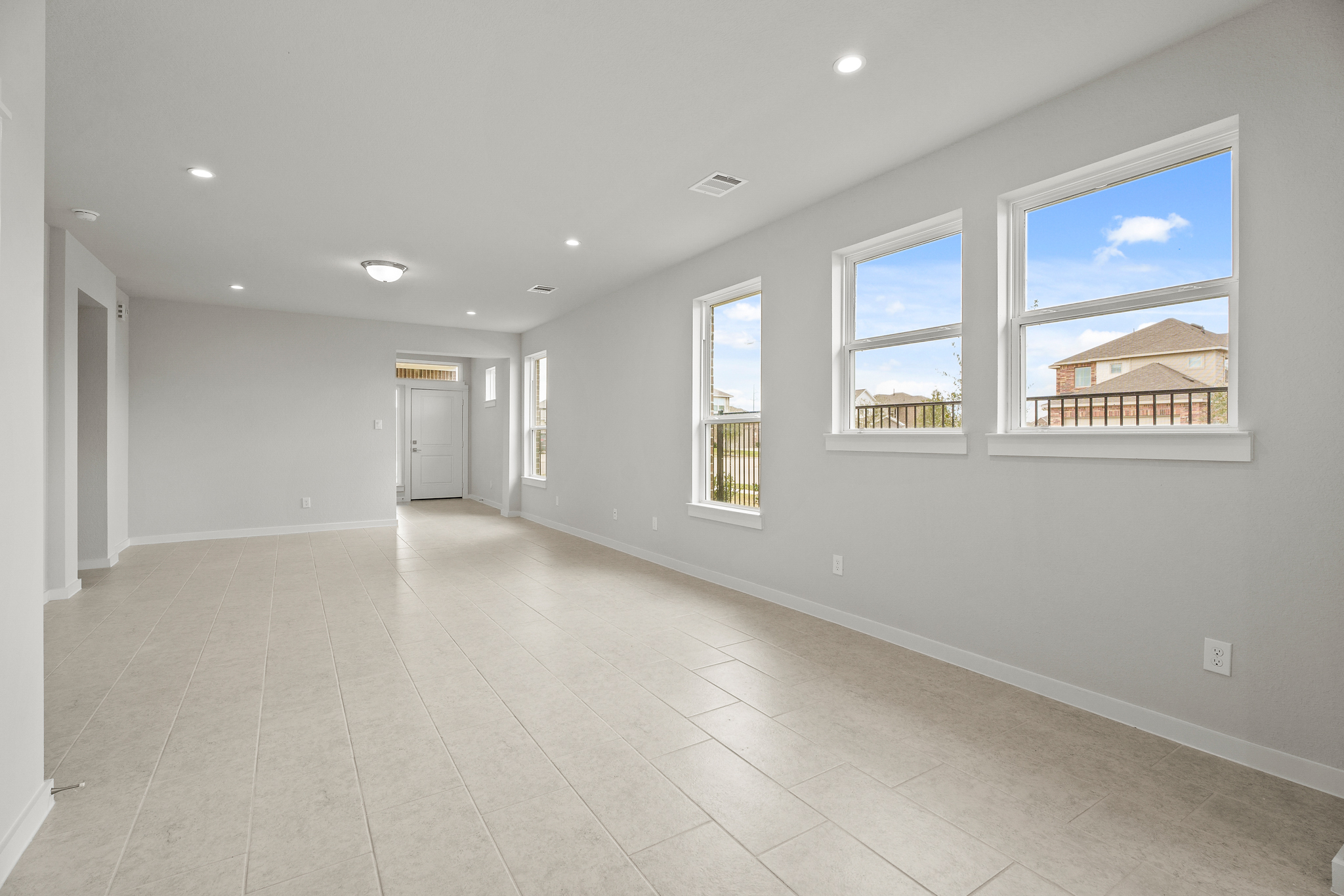A large white room with a large window.