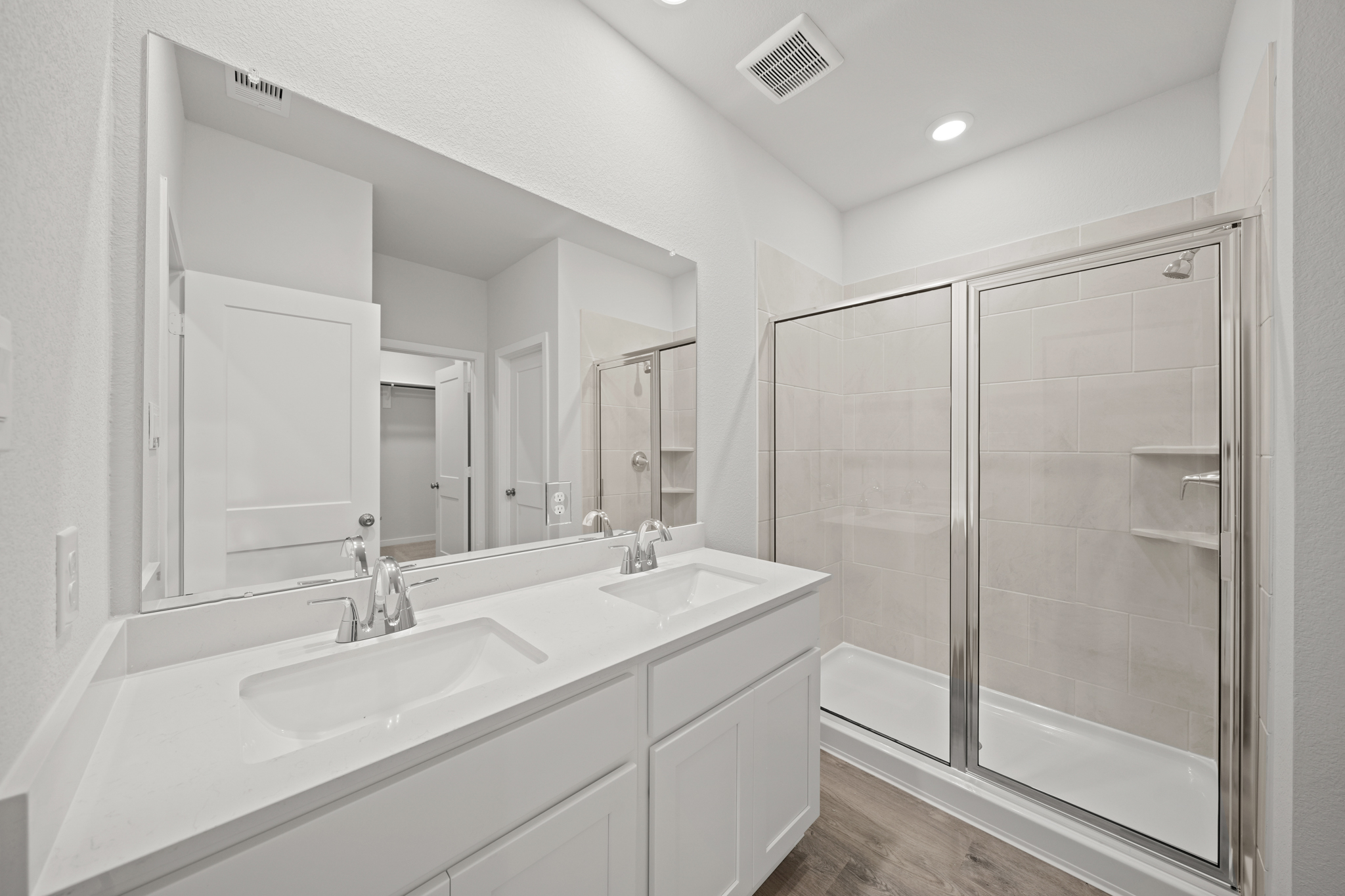 A bathroom with a glass shower.