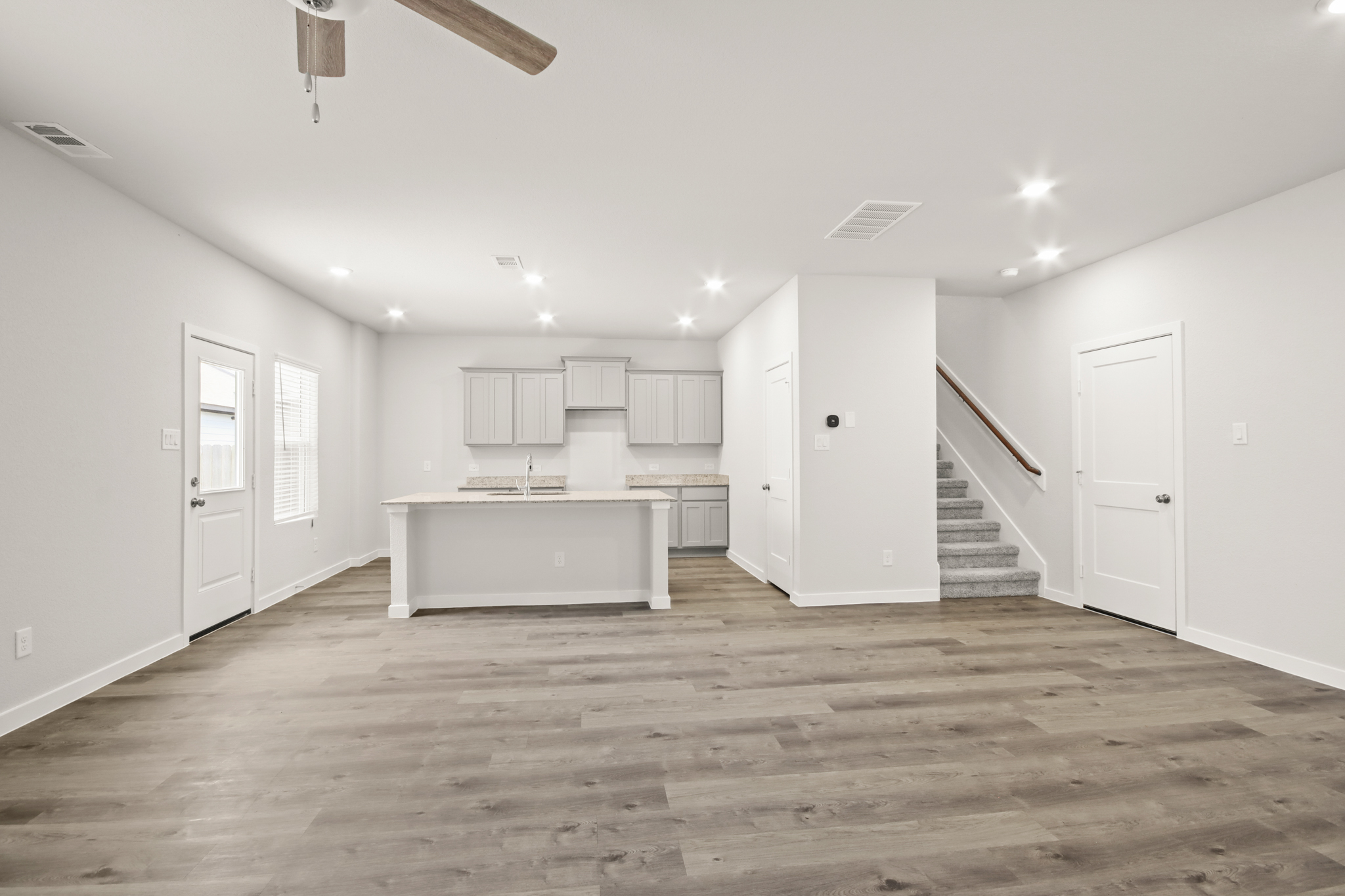 A room with white cabinets.