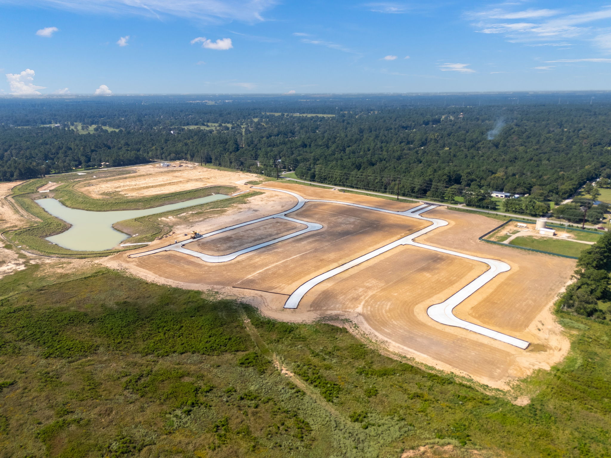 A landscape with a road and trees.