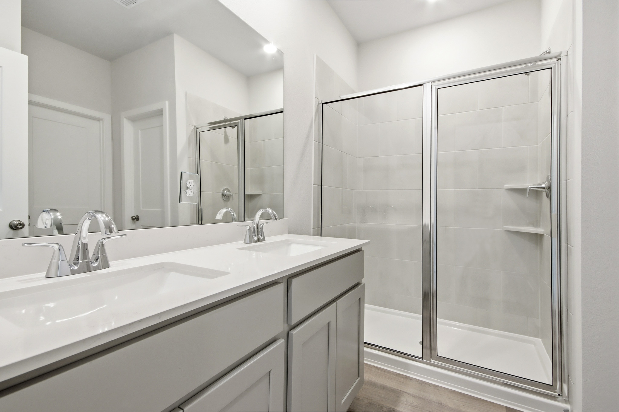 A bathroom with a glass shower.