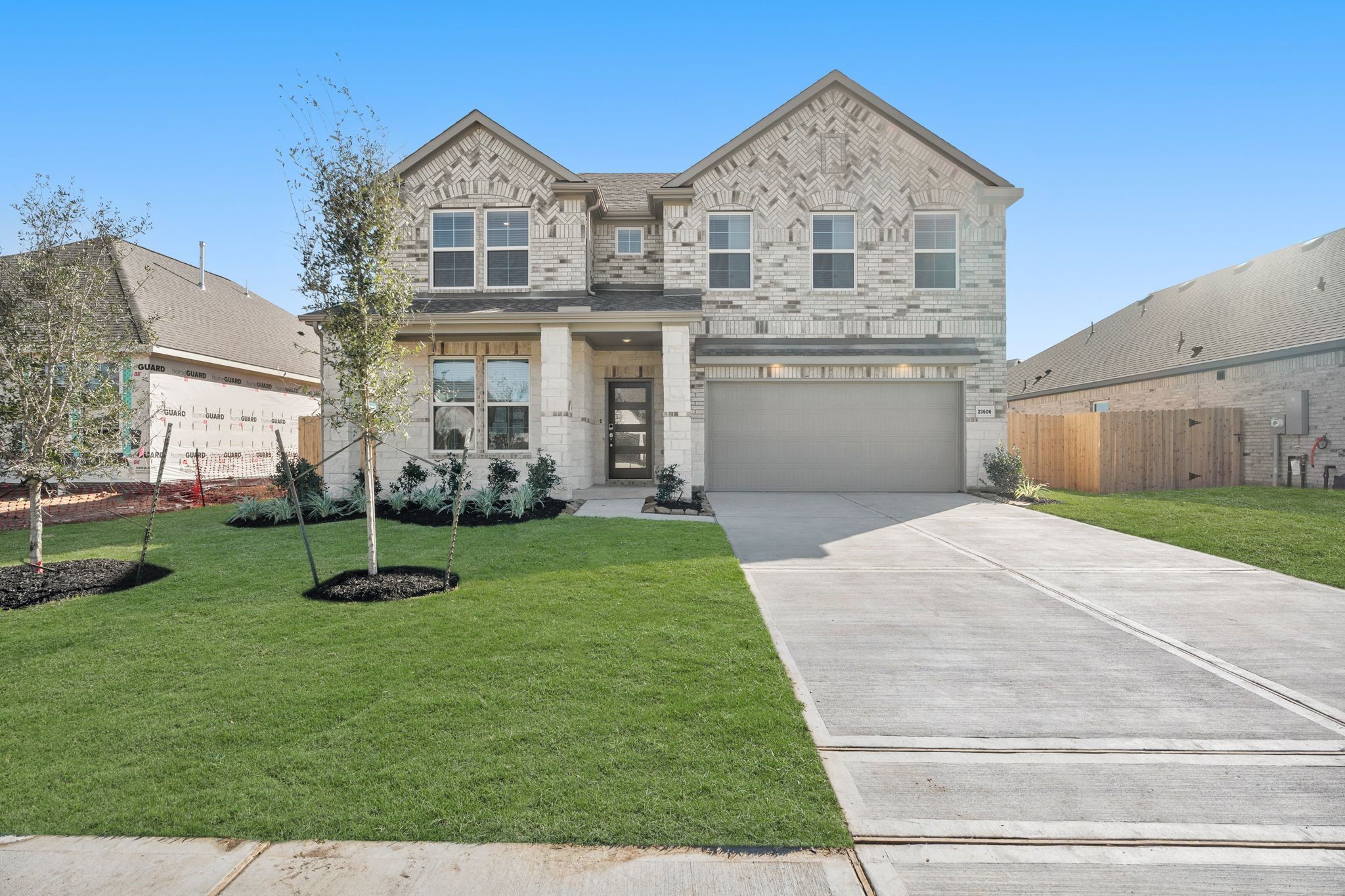 A large house with a driveway.