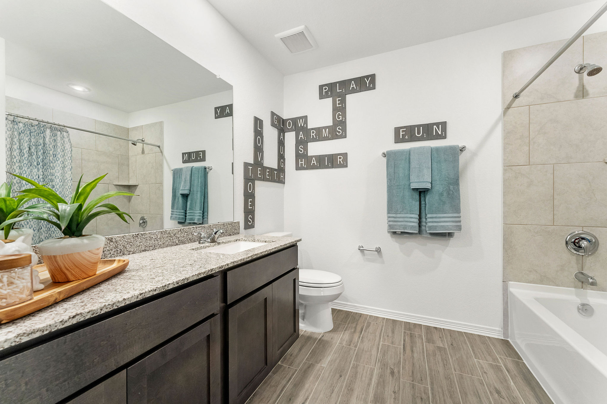 A bathroom with a marble countertop.