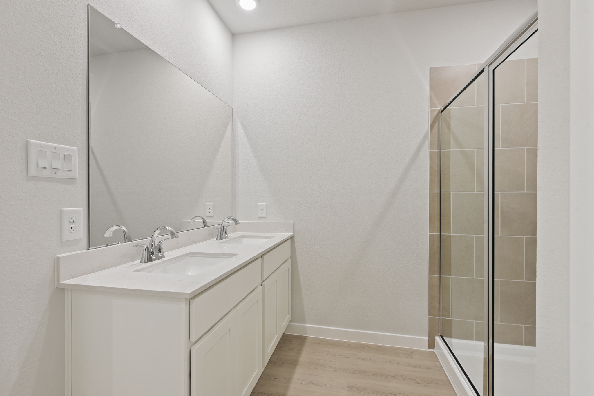 A bathroom with a glass shower.