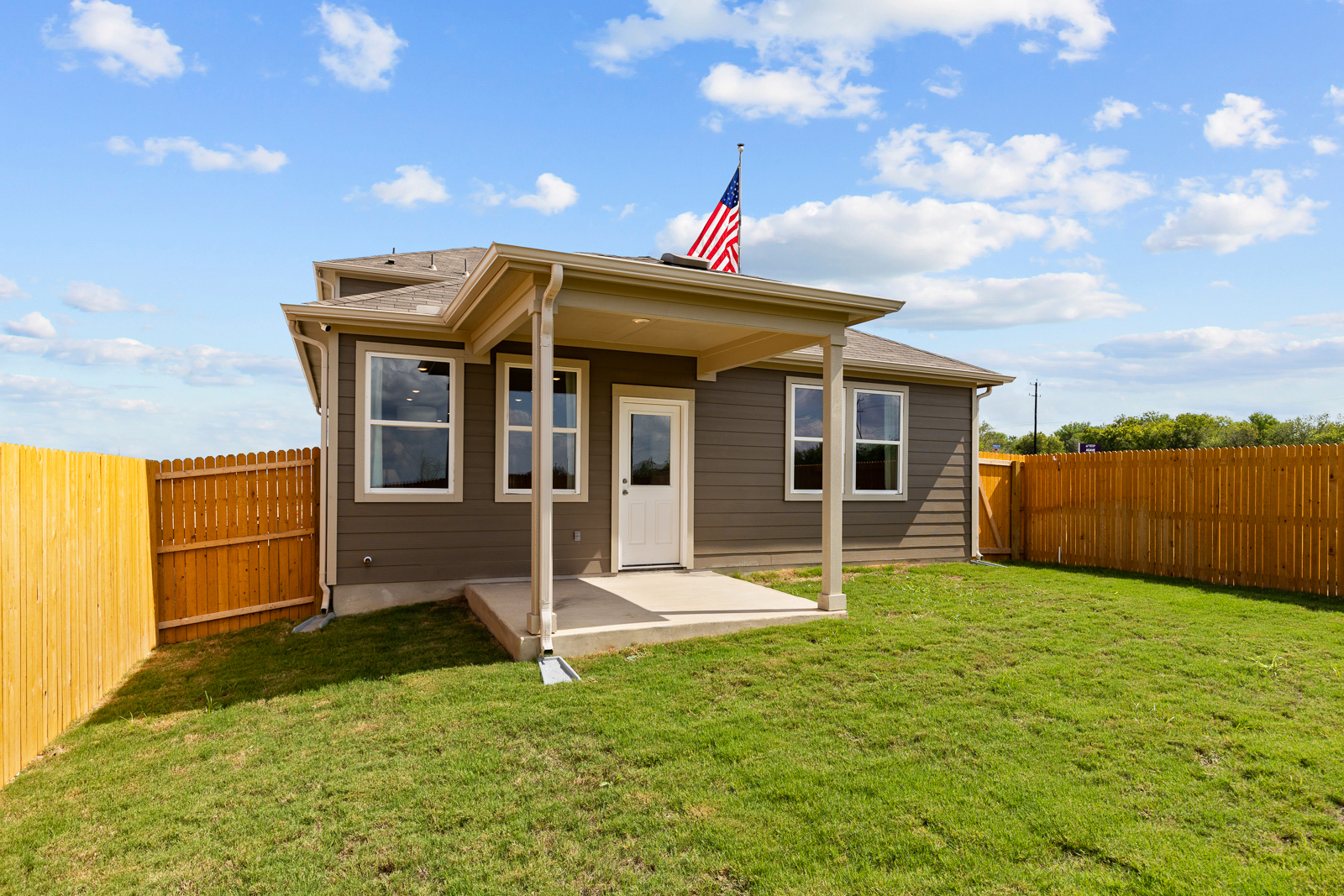 A small house with a flag on the roof.